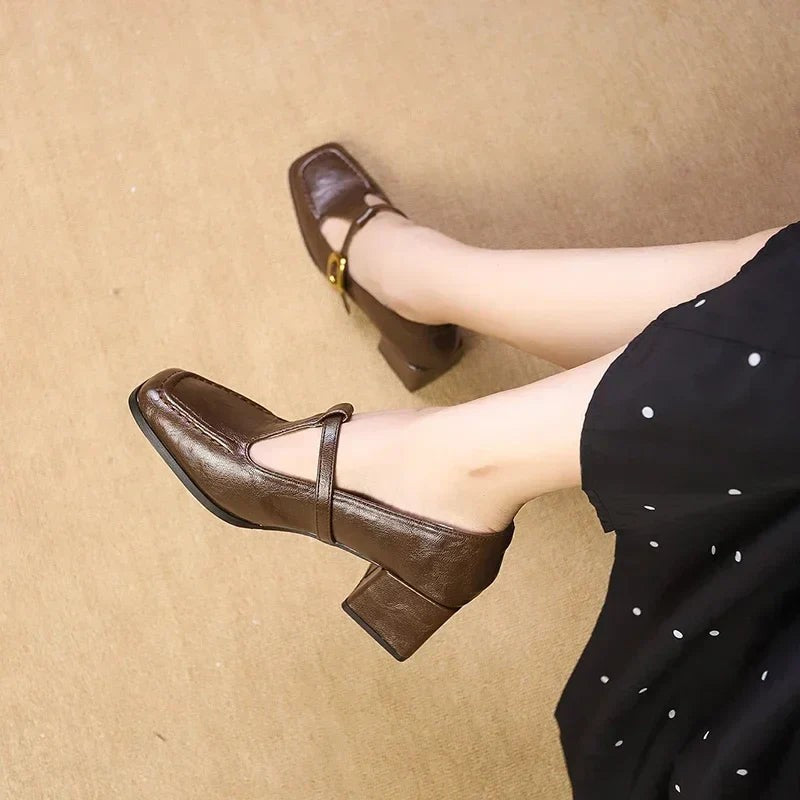 Brown Mary Jane block heels worn with polka dot midi dress