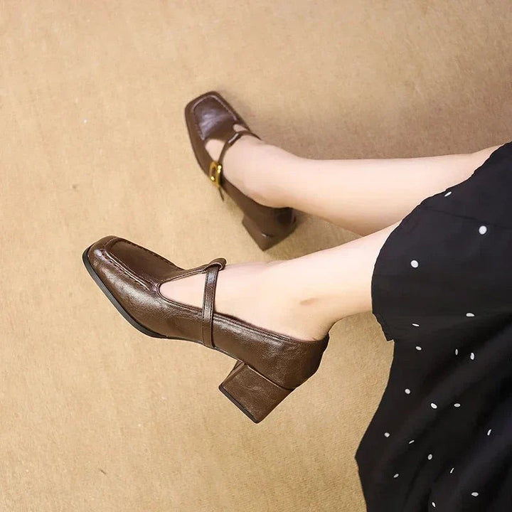 Brown Mary Jane block heels worn with polka dot midi dress