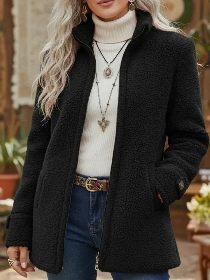 Black teddy fleece zip-up coat with stand collar and cuffed sleeves