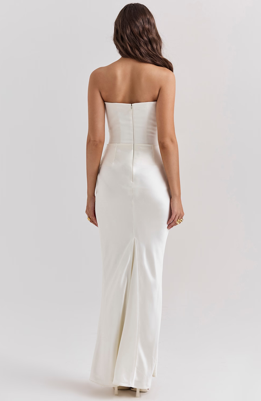 black strapless corset gown close-up on stone steps