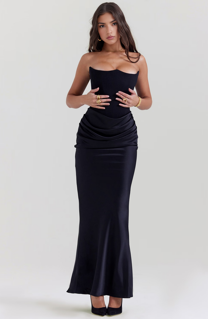 black corset dress close-up with draped satin waist