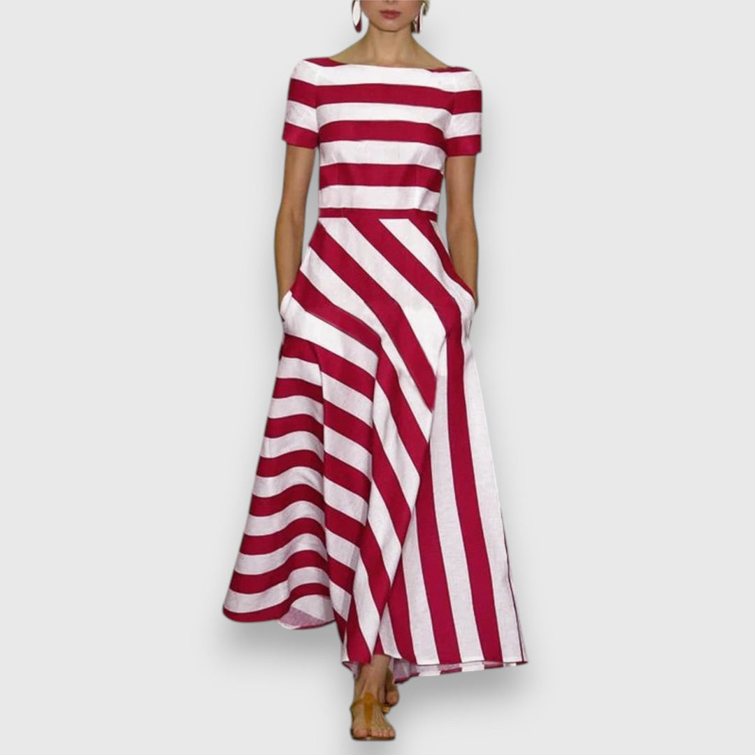 Red and white striped maxi dress featuring short sleeves and flowing skirt