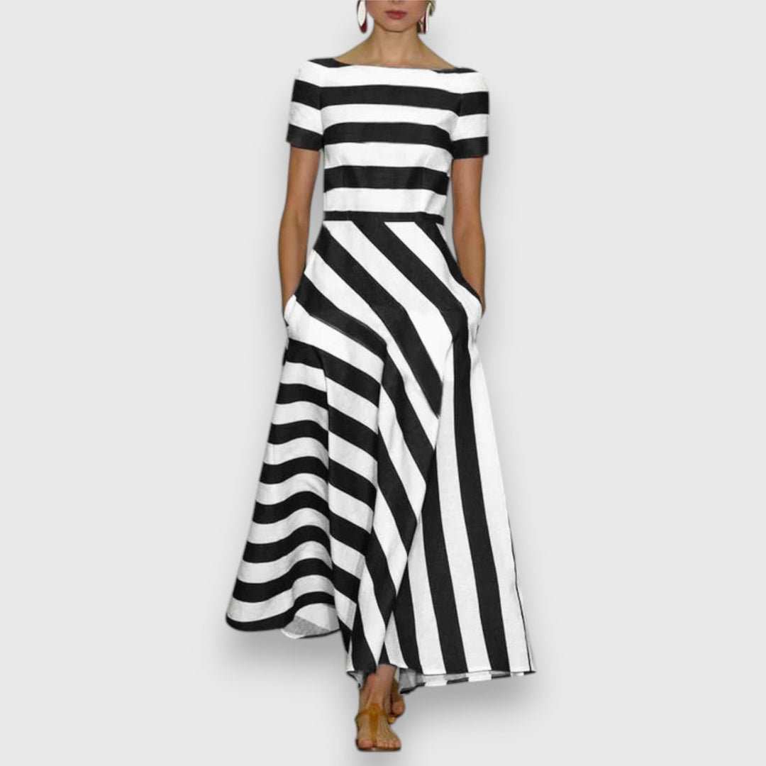 Black and white striped maxi dress with boat neckline and asymmetric hemline