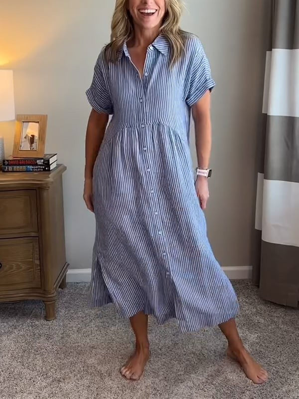 Blue striped shirt dress with button front worn indoors barefoot