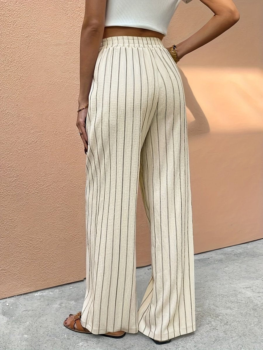 Beige striped wide-leg pants with elastic waistband, back view close-up