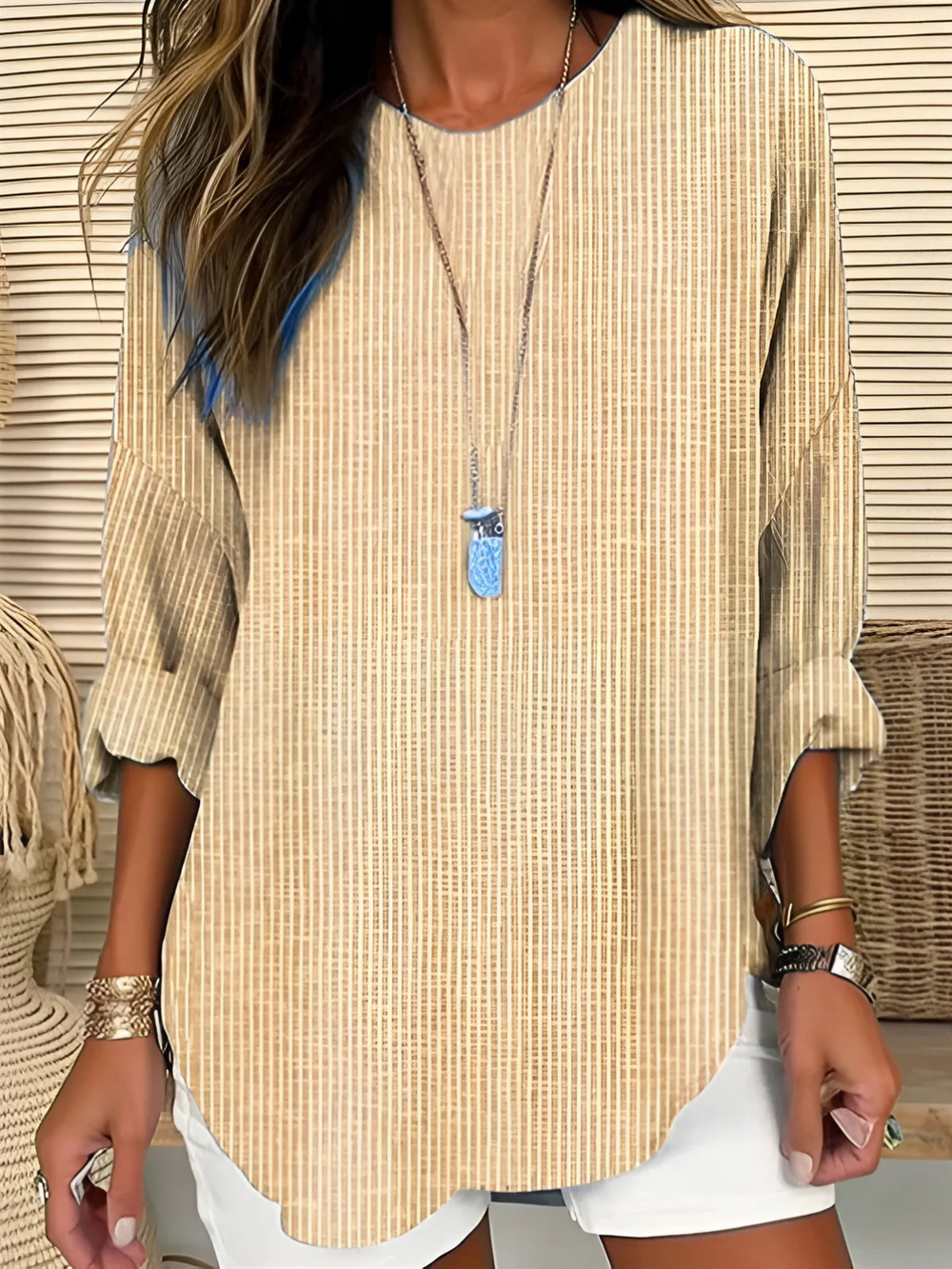 tan striped tunic top with curved hem and relaxed fit