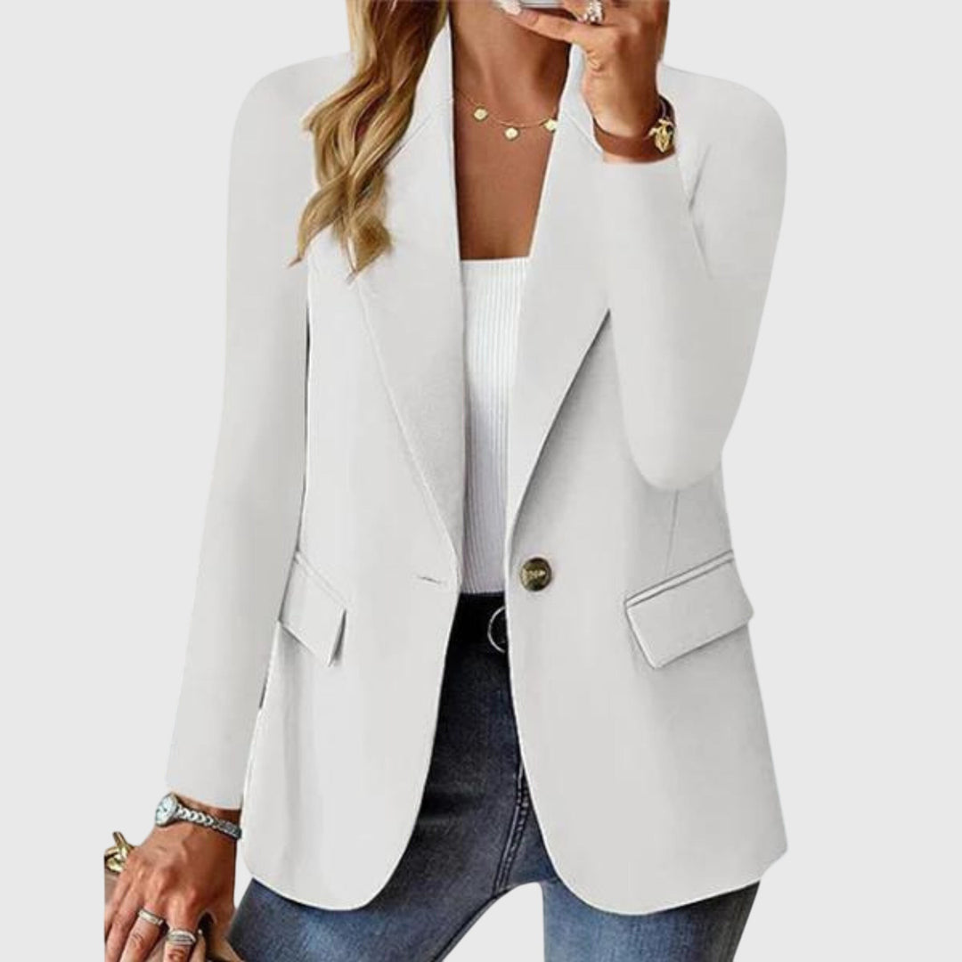 White structured blazer with notch lapel and flap pockets, worn open
