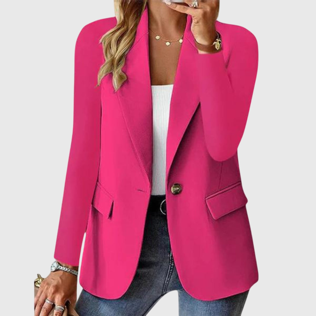Hot pink single-button blazer with notch lapel, worn open over jeans