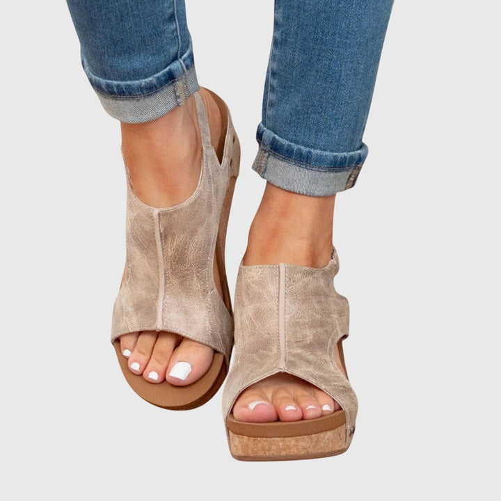 Taupe wedge sandals with peep toe and cork platform sole, front view