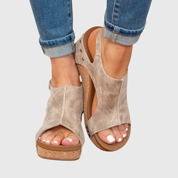 Studded taupe wedge sandals with slingback strap and open toe design