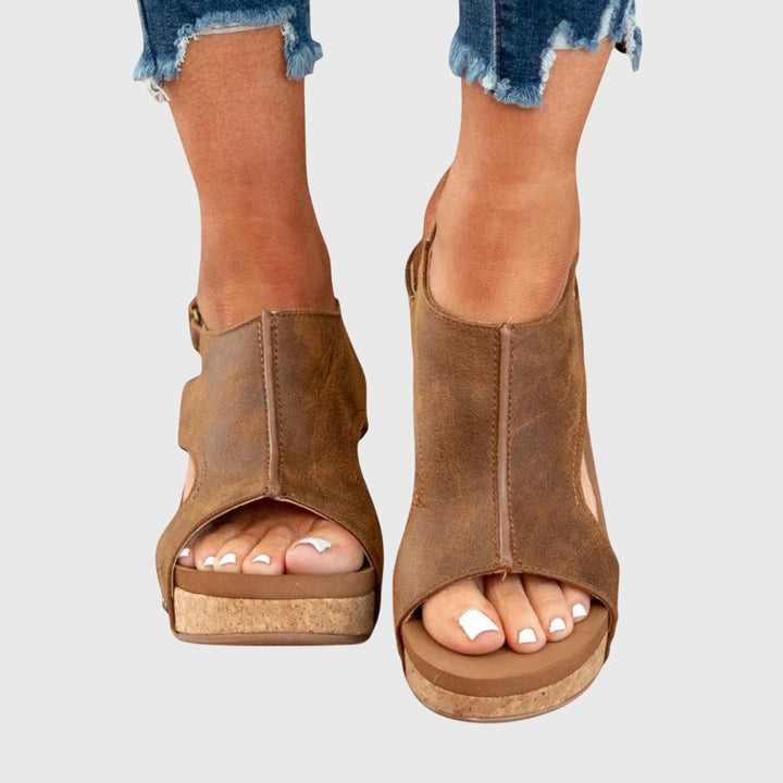 Brown leather wedge sandals with open toe and cork platform sole