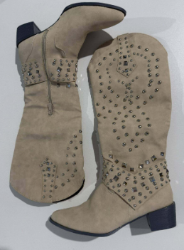 Beige knee-high studded boots with rhinestone accents and pointed toe design