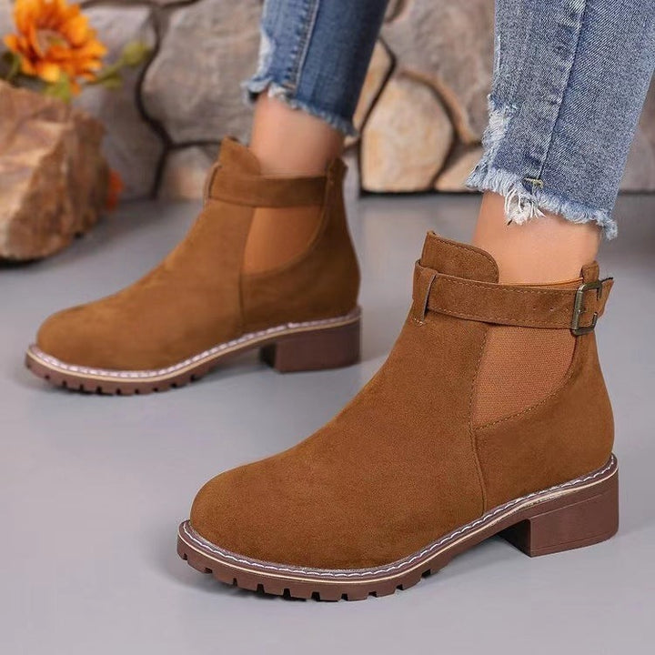Tan suede Chelsea boots with buckle strap and chunky stitched sole
