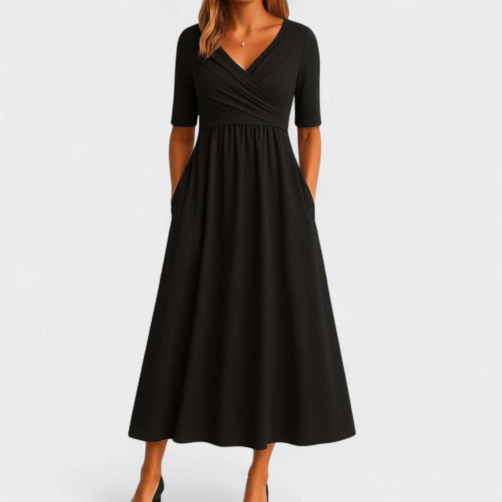 Black wrap-front midi dress featuring V-neck, short sleeves, and pockets
