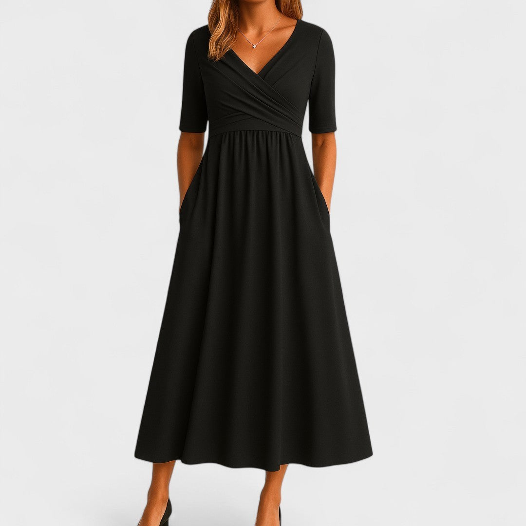 Black wrap-front midi dress featuring V-neck, short sleeves, and pockets