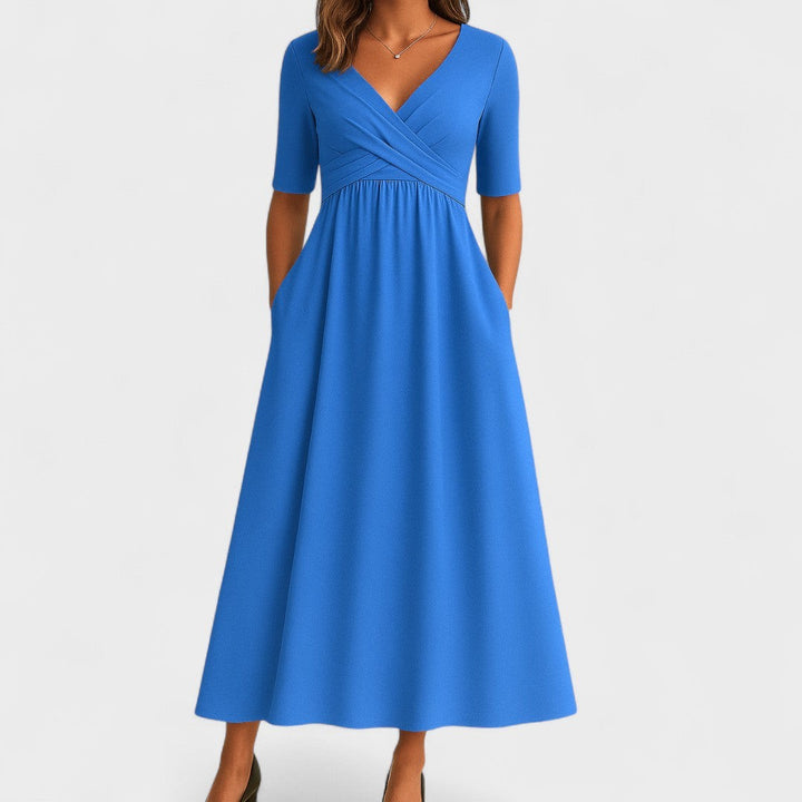 Cornflower blue midi dress with V-neck, short sleeves, and side pockets