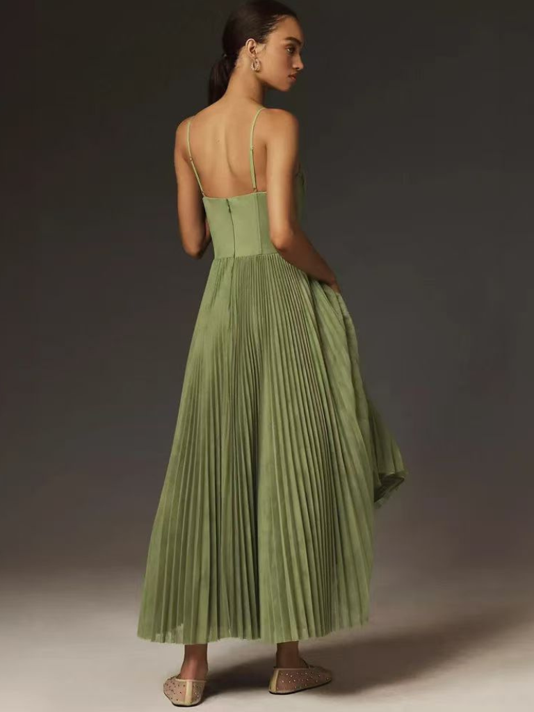 Back view of sage green pleated maxi dress with corset-style bodice