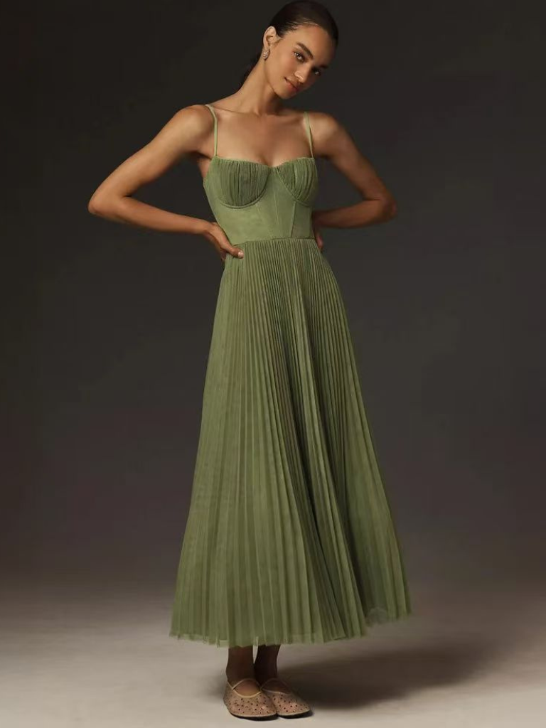 Sage green pleated maxi dress with bustier top and ballet flats, front view