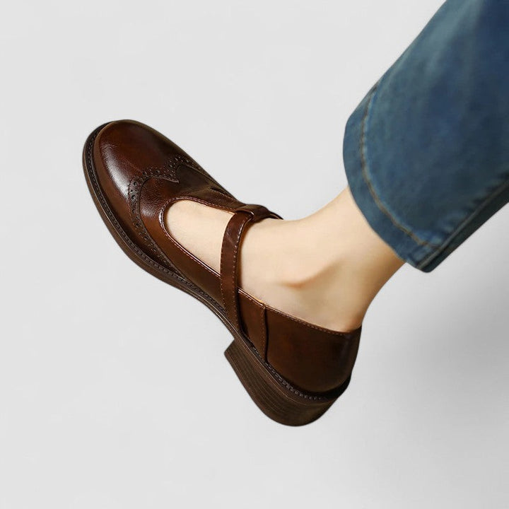 Brown leather Mary Jane shoe worn with cropped jeans, brogue toe detail