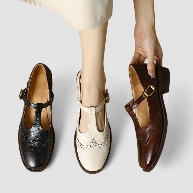 Three colorways of T-strap Mary Jane shoes in black, cream, and brown leather