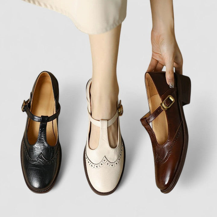 Three colorways of T-strap Mary Jane shoes in black, cream, and brown leather