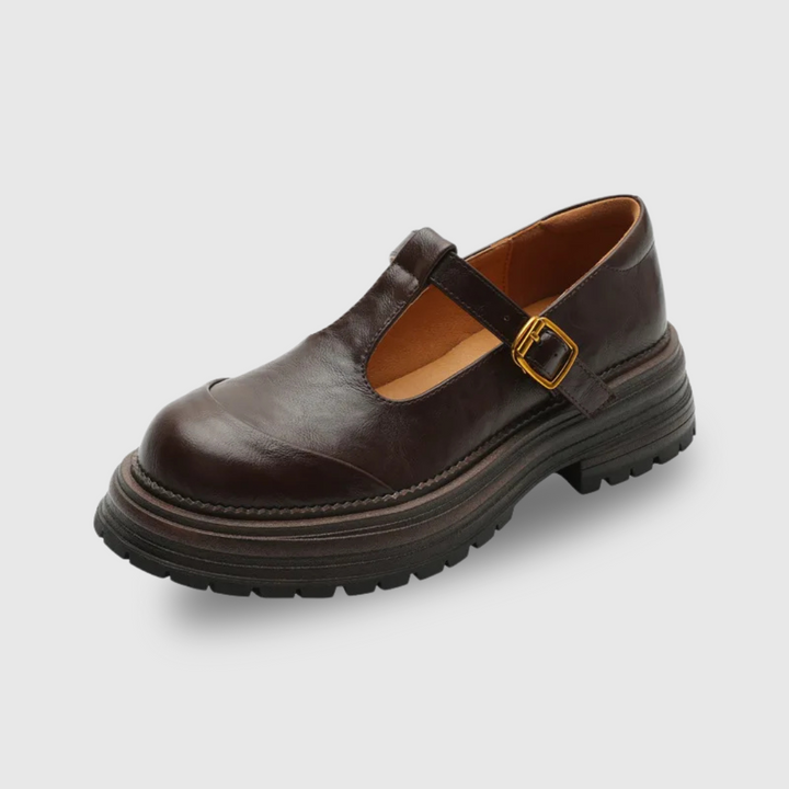 Brown leather T-bar Mary Jane shoe with lugged platform sole, angled view