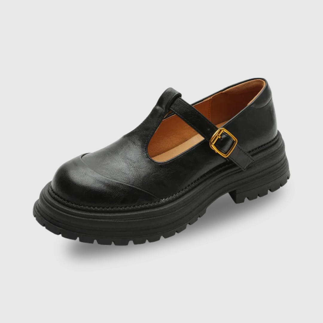Black leather T-bar Mary Jane shoe with round toe and lugged sole