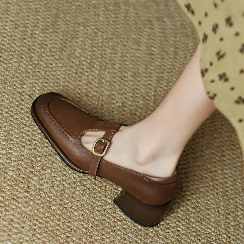 Side view of brown Mary Jane shoe with square toe and wood-tone heel