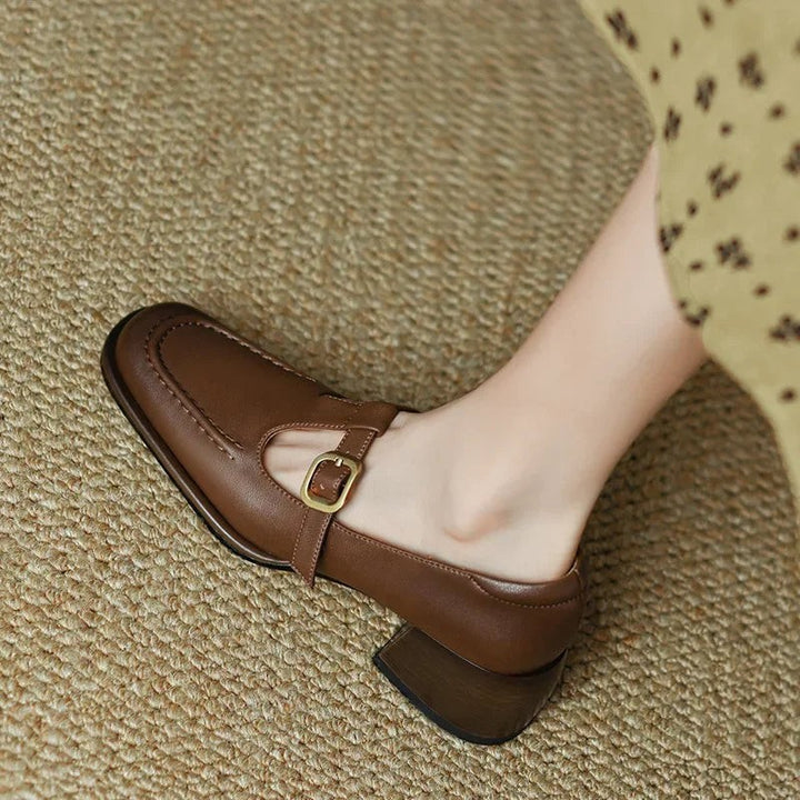 Side view of brown Mary Jane shoe with square toe and wood-tone heel