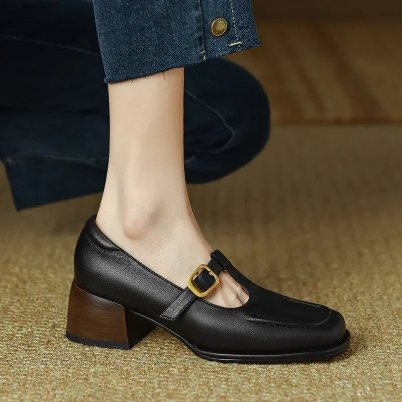 Side profile of black T-strap Mary Jane with wooden block heel