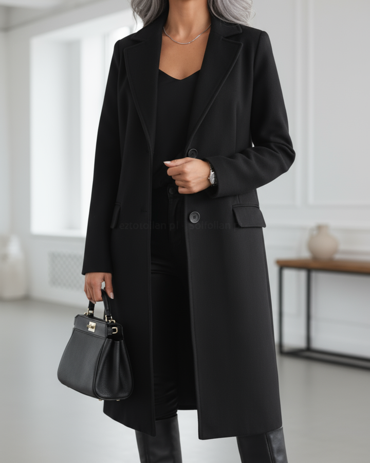 Black longline wool coat with notch lapel styled with matching handbag