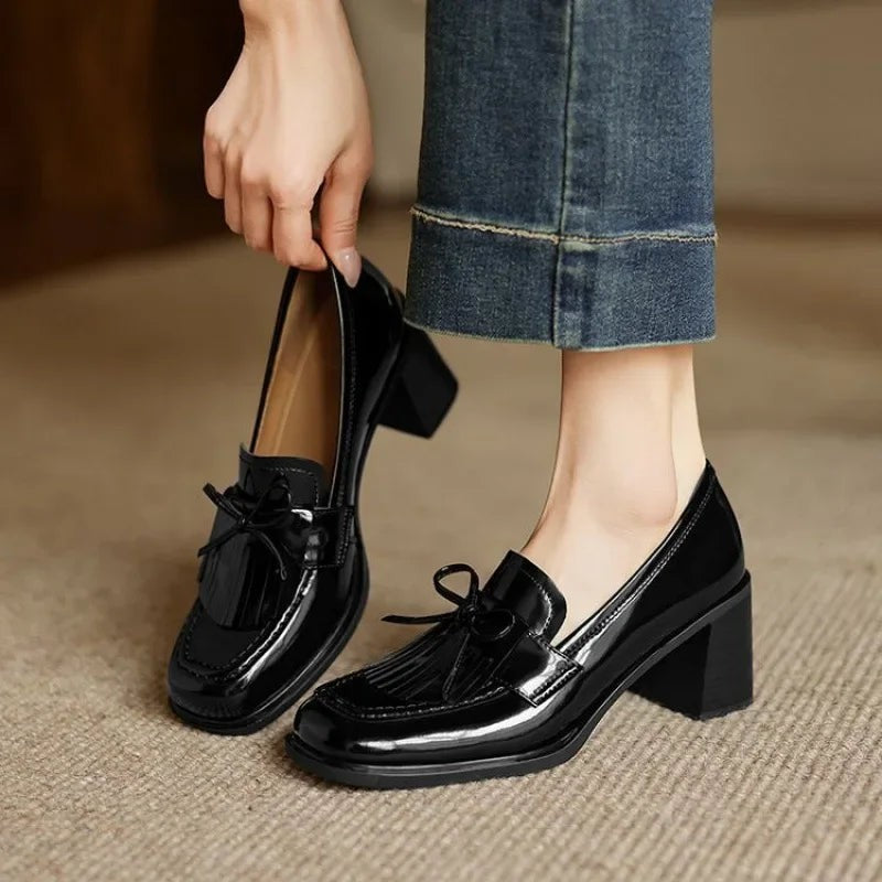 Black patent leather tassel loafer pumps with chunky block heel