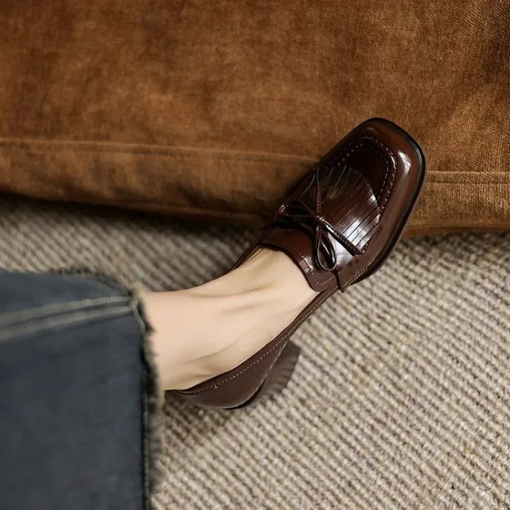 Brown patent leather tassel loafer pump with block heel