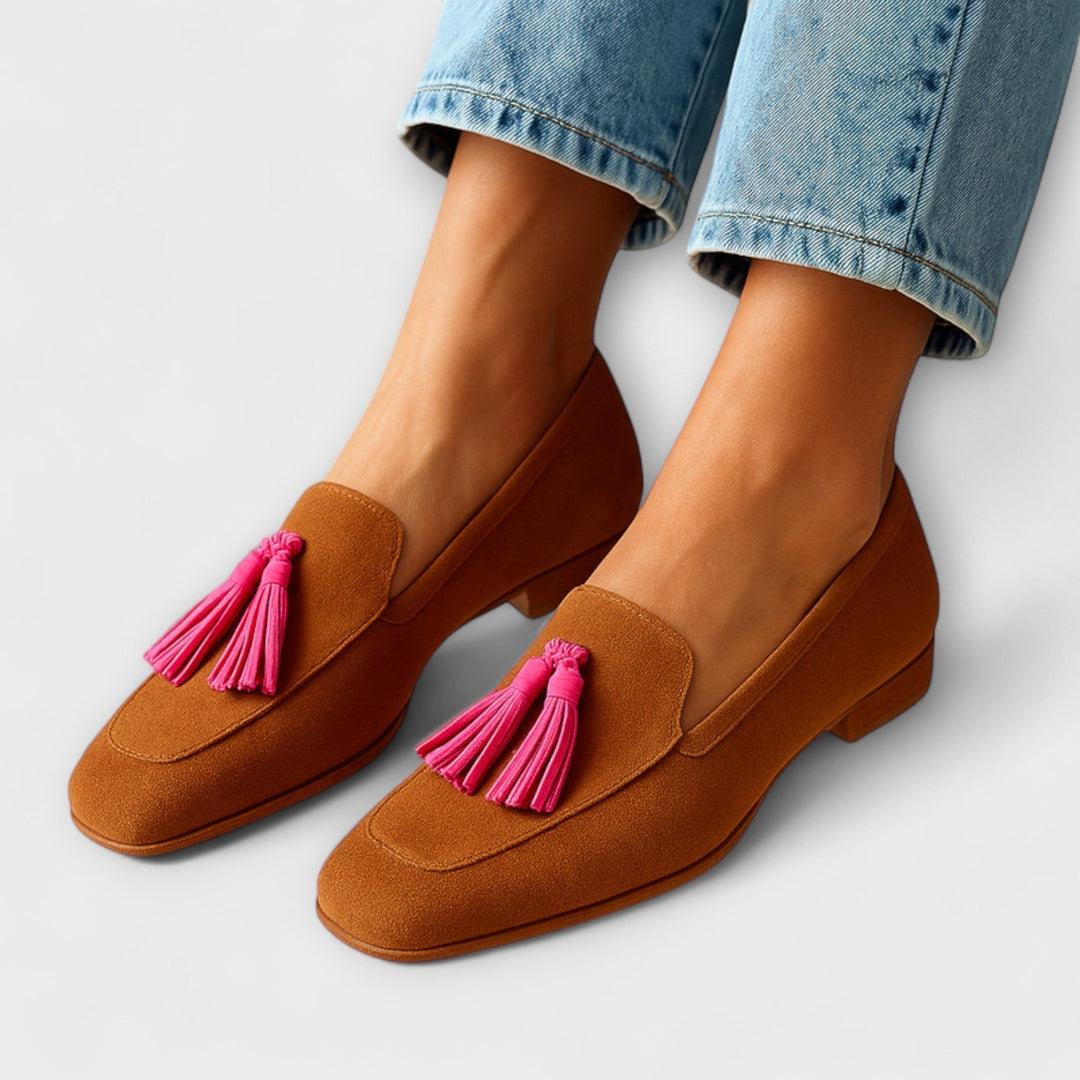 Cognac suede loafers with pink tassel detail worn with cropped jeans
