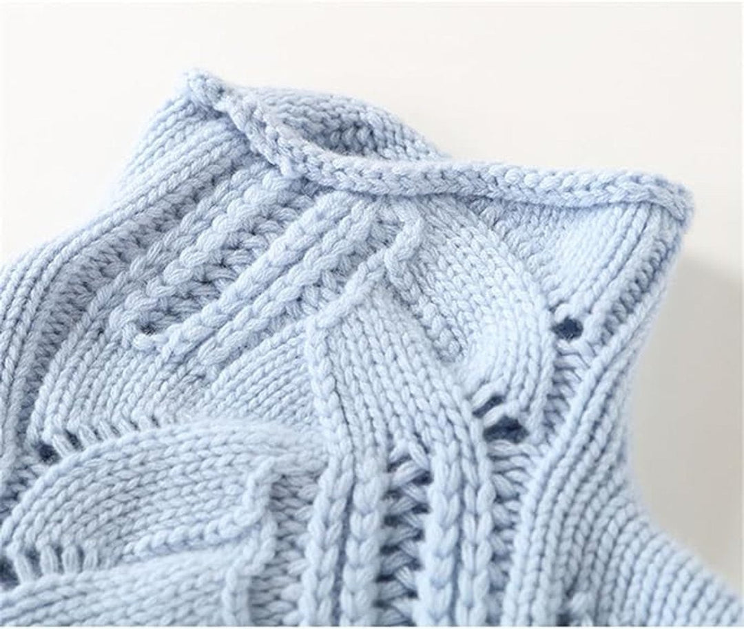 close-up of light blue cable knit turtleneck collar detail