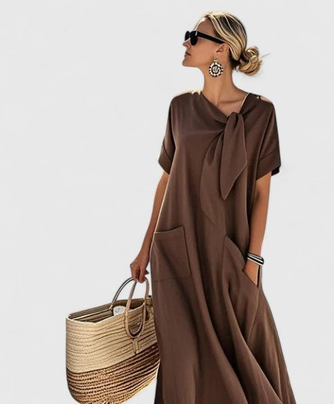 Brown maxi dress with tie-neck detail and front pockets, short sleeves