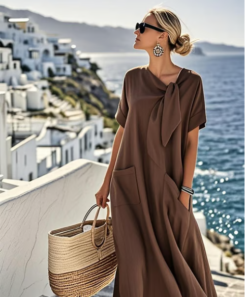 Brown tie-neck maxi dress with flowy A-line skirt and front pockets