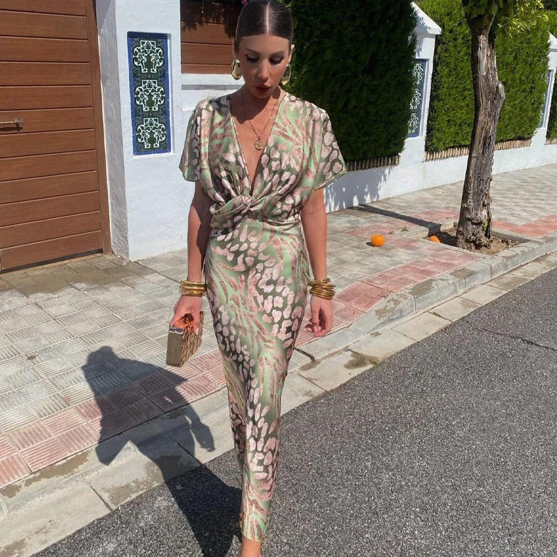 Sage green leopard print maxi dress with plunging V-neck and twist front detail