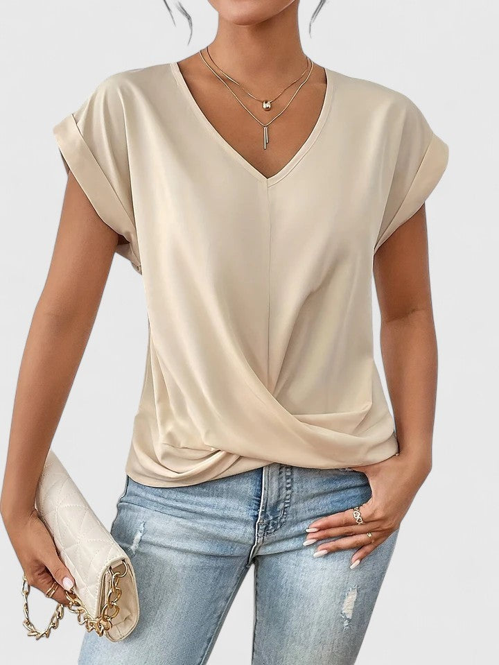 beige V-neck top with twist-front hem and cap sleeves