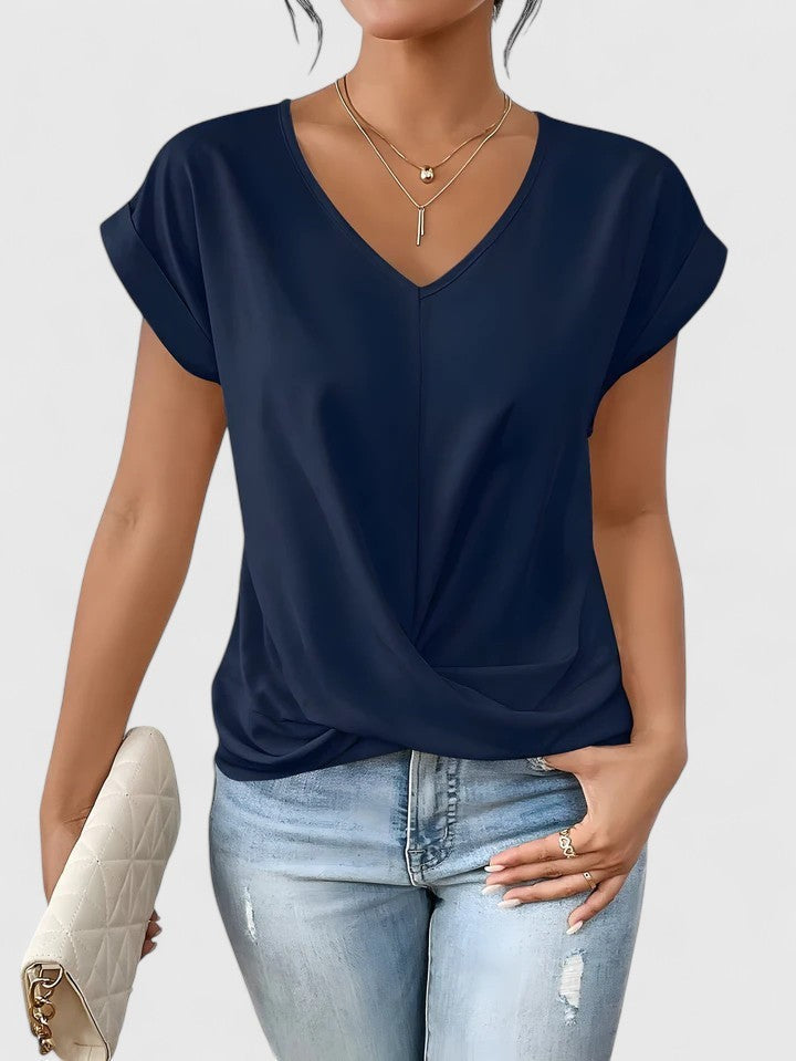 navy blue V-neck top with draped twist-front and cap sleeves