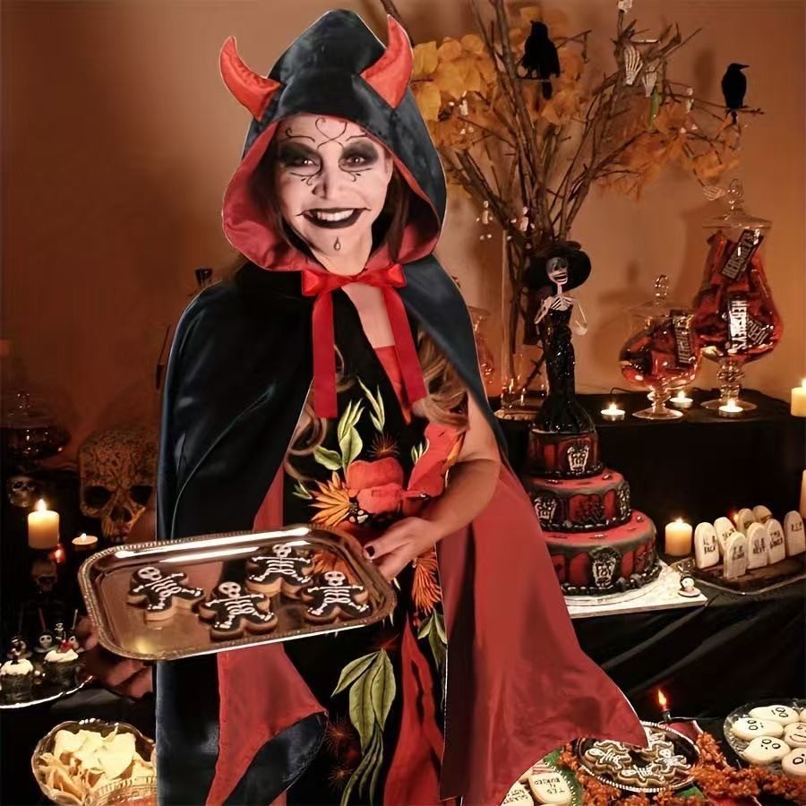 Devil costume cape with horned hood worn over floral Halloween dress