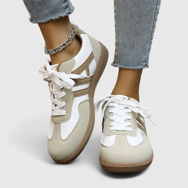White and beige suede lace-up sneakers with tan stripe detail and gum sole