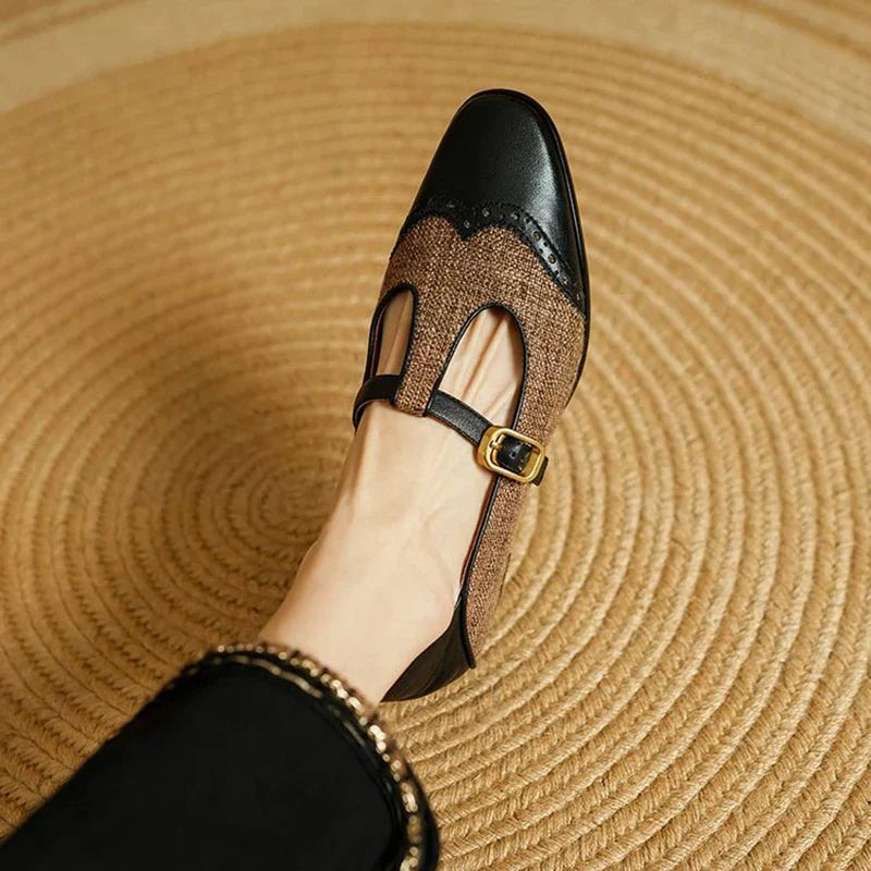 Overhead view of black tweed Mary Jane flat with brogue wingtip toe