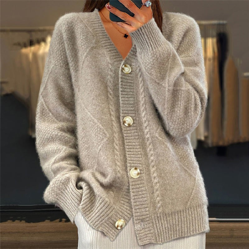 Oatmeal beige cable-knit cardigan featuring button fastening and ribbed cuffs