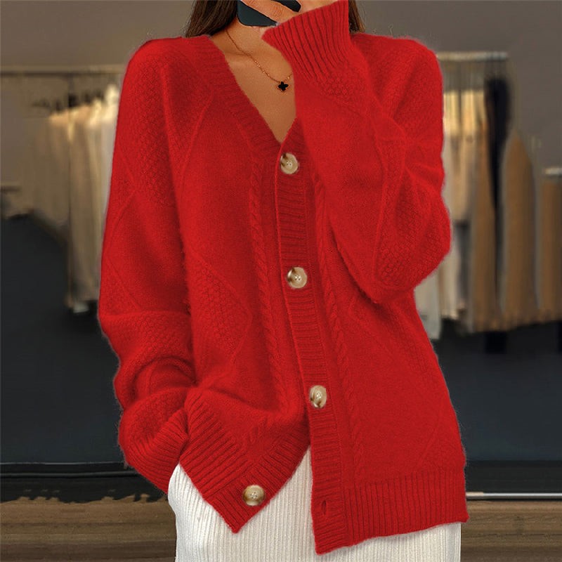 Red cable-knit cardigan with button-front closure and ribbed hem