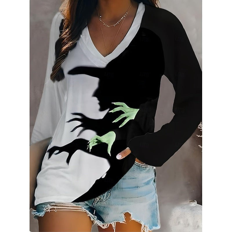 White and black long-sleeve top with witch shadow graphic and V-neck