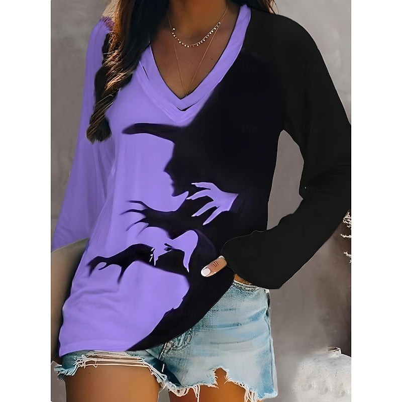 Purple and black Halloween top with witch shadow design and long sleeves