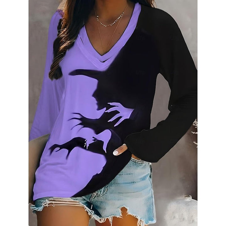 Purple and black Halloween top with witch shadow design and long sleeves