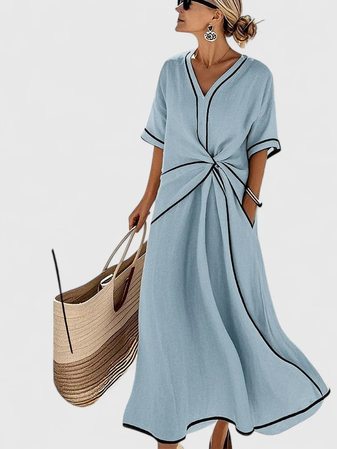 Light blue V-neck maxi dress featuring black trim and twisted waistline