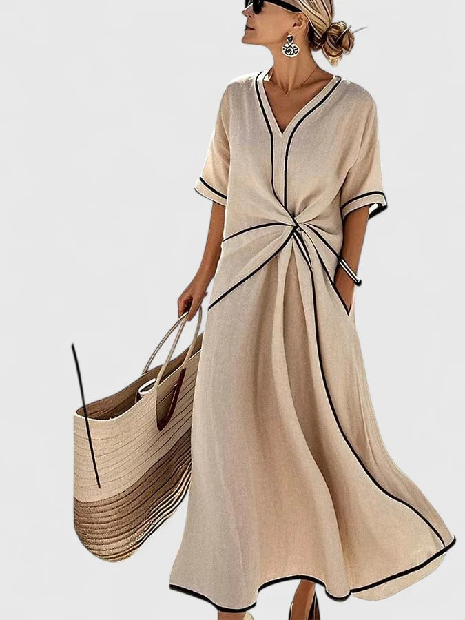 Sand-colored midi dress with black piping, half sleeves, and knot waist